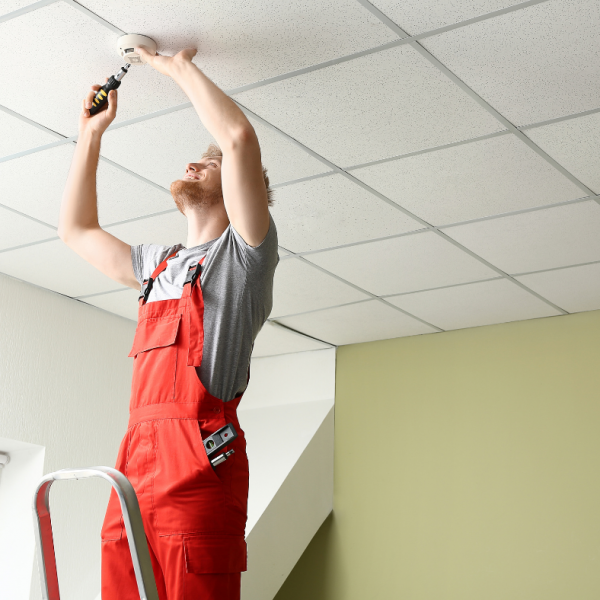 Man installing on ceiling.