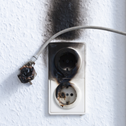 Burnt wall socket.